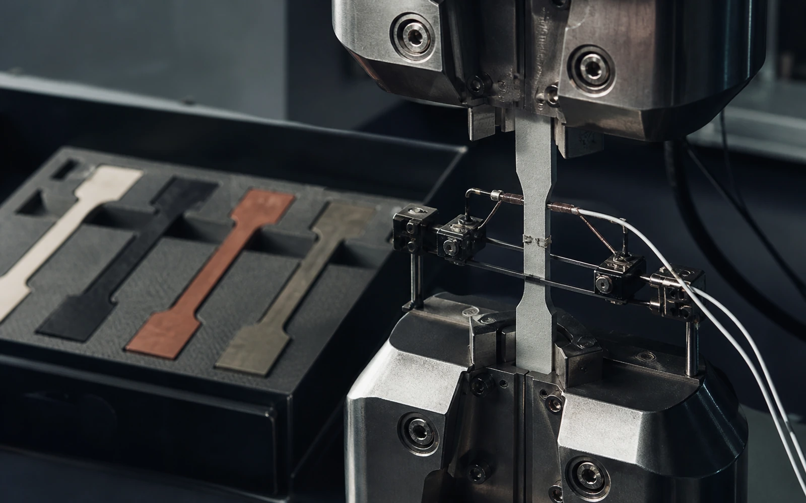 Conceptual image of an advanced-material specimen undergoing instrumented mechanical testing